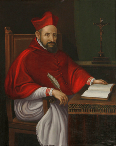Saint Robert Bellarmine seated at a desk