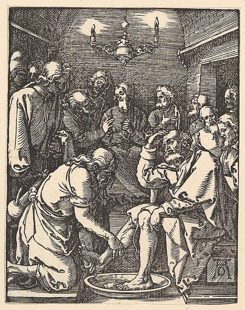 Christ kneeling to wash an apostle’s feet, with the disciples gathered around Him